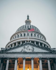 United States Capitol in Washington D.C. with US flag waving